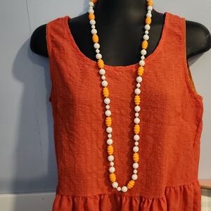 Orange Sleeveless Dress with Beaded Necklace